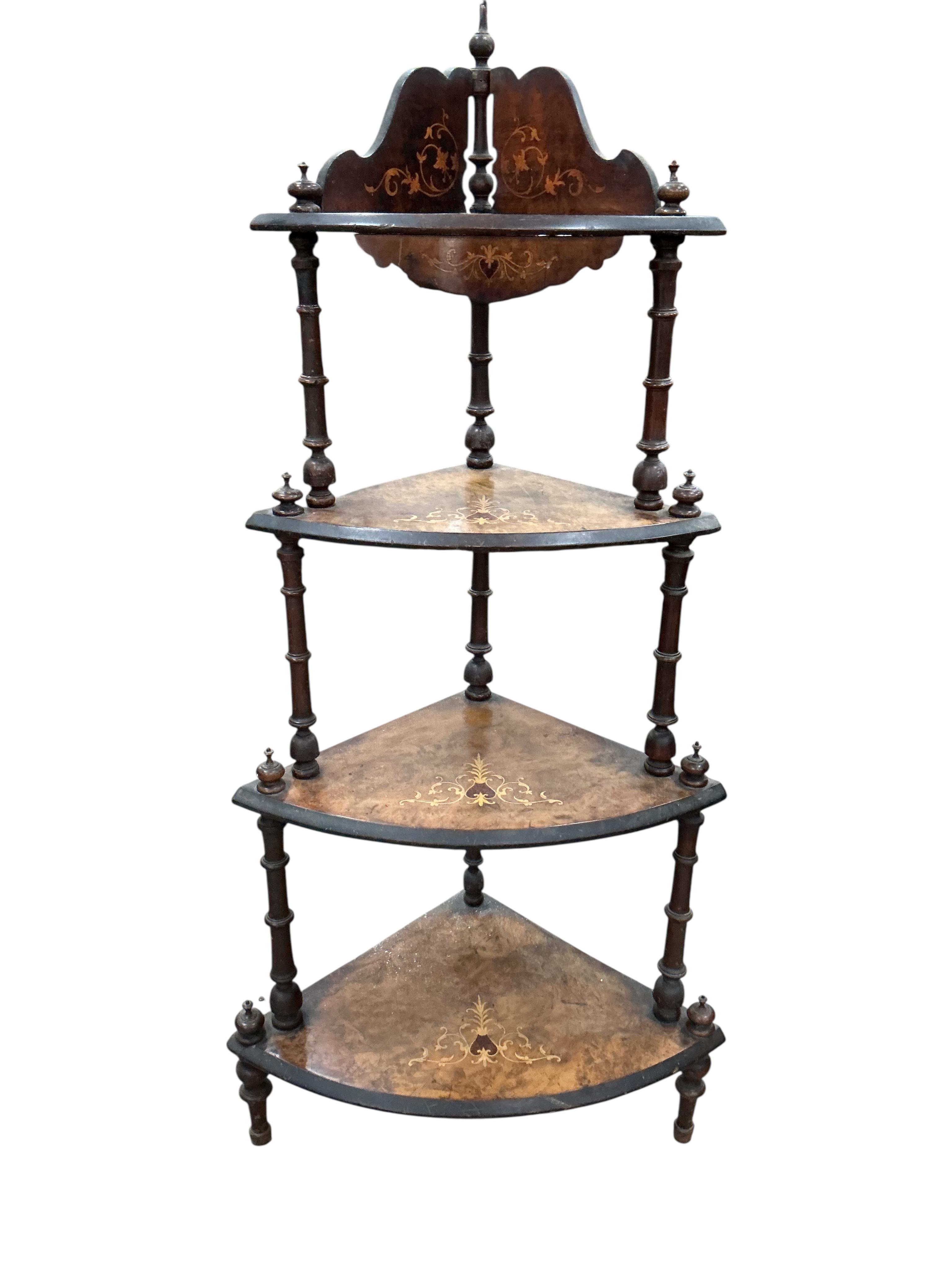 A Victorian inlaid walnut corner whatnot, width 64cm, depth 40cm, height 132cm.